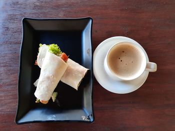 High angle view of coffee in cup on table