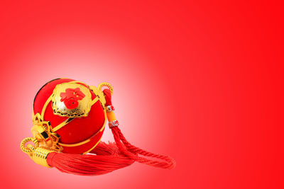 Close-up of christmas decoration against red background