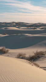 Scenic view of desert against sky during sunset