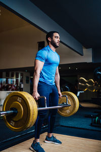 Portrait of man in fitness training with dumbbell equipment., 

