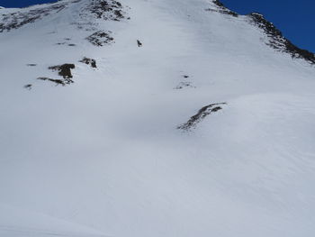 High angle view of snow covered mountain against sky