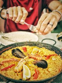 Midsection of man preparing food