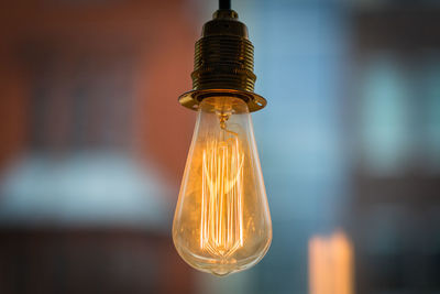 Close-up of illuminated light bulb