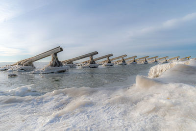 Scenic view of sea against sky during winter