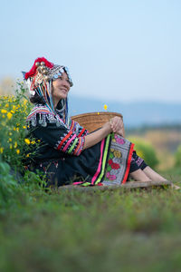 Woman sitting on field