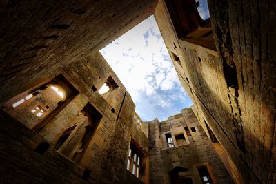 Low angle view of old building against sky