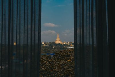 Buildings seen through glass window