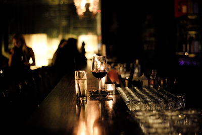 Close-up of glasses at bar counter