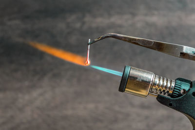 Close-up of fire emitting from blow torch