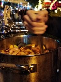 Close-up of person preparing food in restaurant