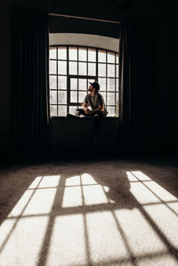 Man sitting by window