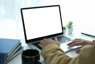 Man using laptop on table