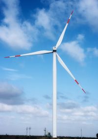 Low angle view of wind turbine against sky