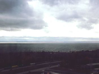 Scenic view of landscape against cloudy sky