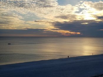 Scenic view of sea against dramatic sky