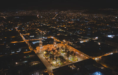 Aerial view of illuminated cityscape at night