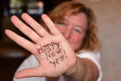 Portrait of woman hand with text