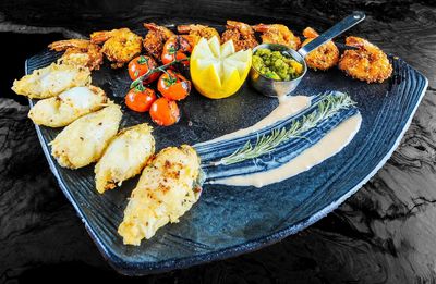 High angle view of fruits in plate on table