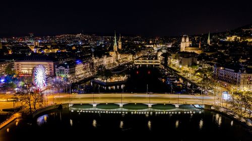 High angle view of illuminated bridge over river at night
