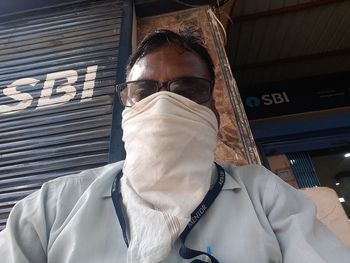 Low angle view of man wearing mask