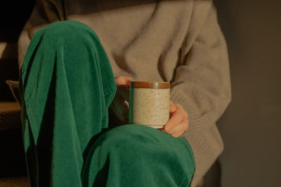 Rear view of woman holding gift