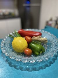 Close-up of fruits and vegetables in plate on table