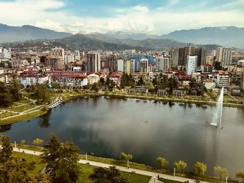 High angle view of buildings and mountains against sky