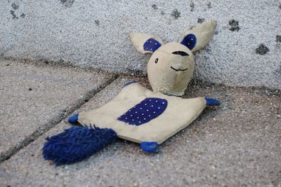 High angle view of stuffed toy on sand