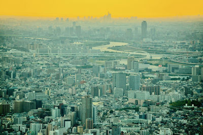 High angle view of modern buildings in city against sky