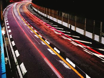 High angle view of light trails on road in city