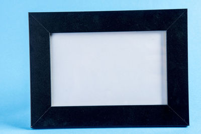 Directly above shot of empty chair against white background