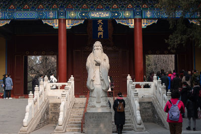 Statue in temple outside building