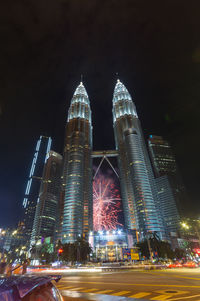 Illuminated modern buildings in city at night