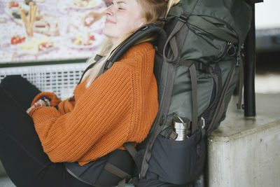 Woman with backpack resting