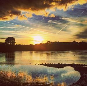 Scenic view of lake at sunset