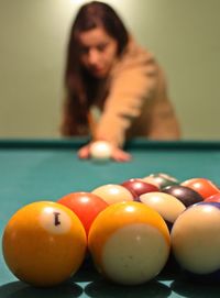 Woman playing with ball on table