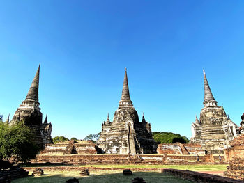 View of ancient temples building against sky