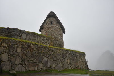 Old ruins of building against clear sky