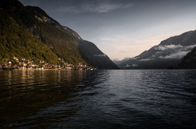 Scenic view of lake and mountains against sky