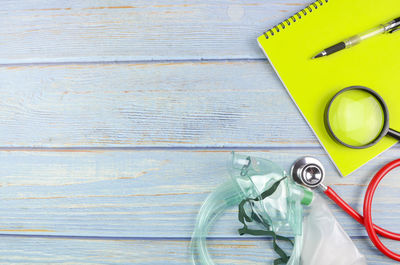 High angle view of yellow container on table