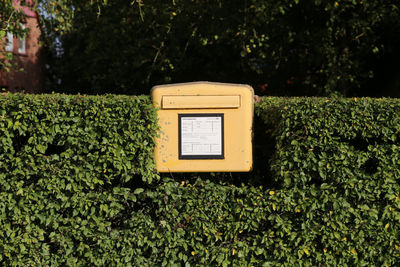 Close-up of mailbox on field