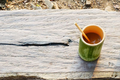 High angle view of tea cup on wood
