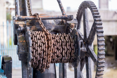 Close-up of rusty chain on machinery