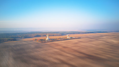 Center space communication. aerial view arable agricultural field. panorama cultivated land on hills