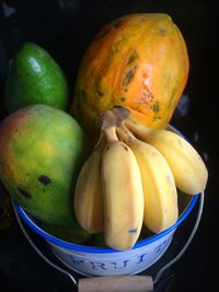 Close-up of fruits in bucket