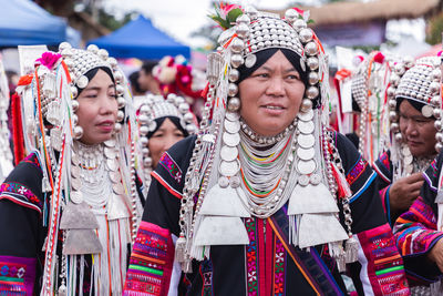 Woman with arms raised in traditional clothing