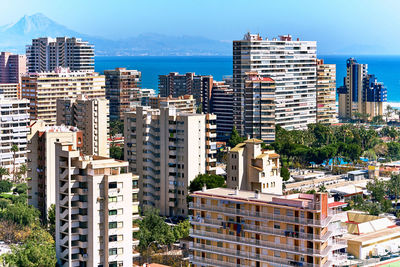 View of cityscape against sea