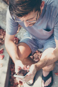 High angle view of man using mobile phone