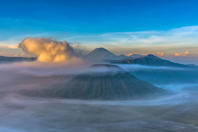 View of volcanic mountain against cloudy sky