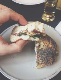 Close-up of hand holding ice cream in plate